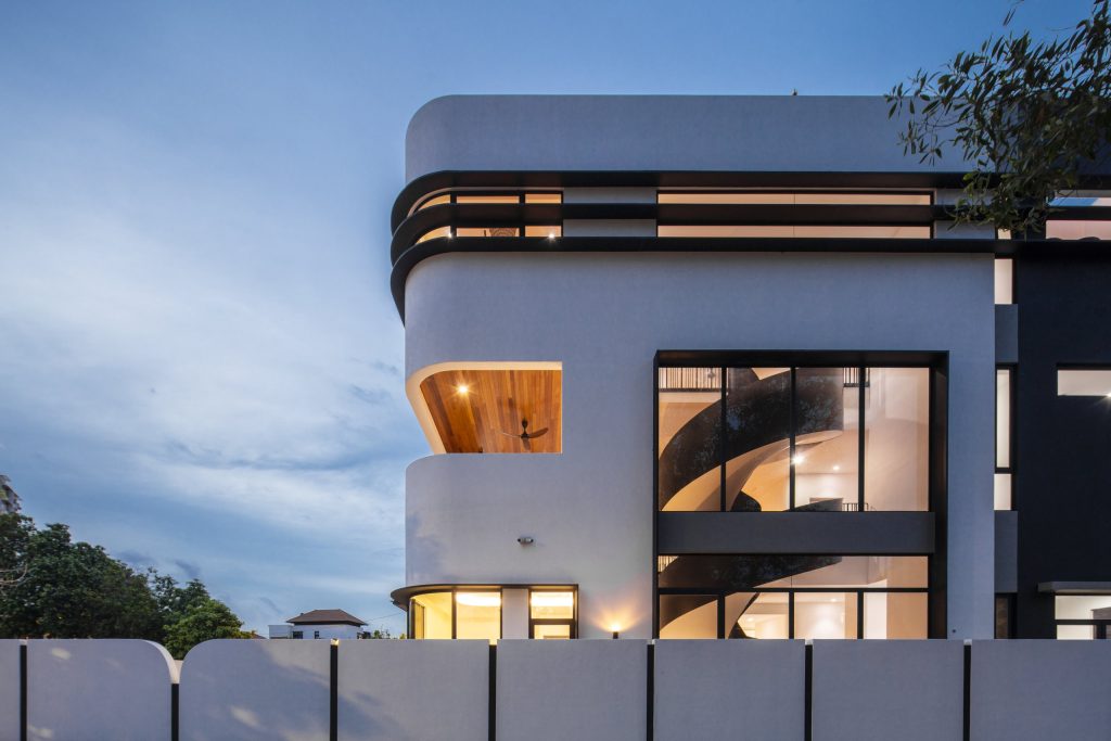 Fillet House: carved white building volumes and rounded corners.