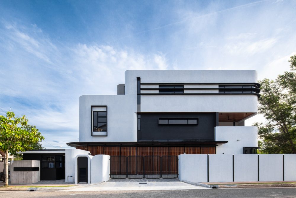 Fillet House: rounded white facade with dark horizontal shading and timber screens.